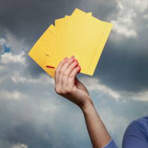 Hand holds up notecards