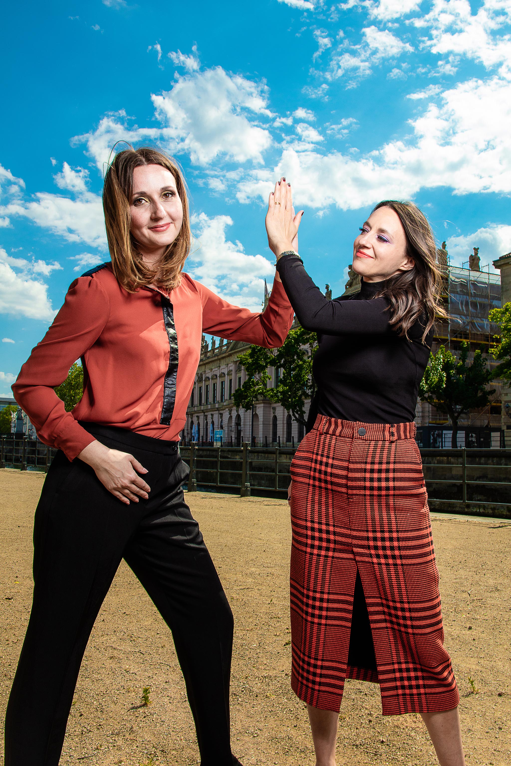 Two women high-five